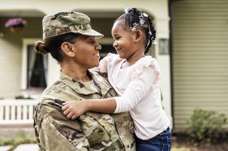 photo of military parent with child