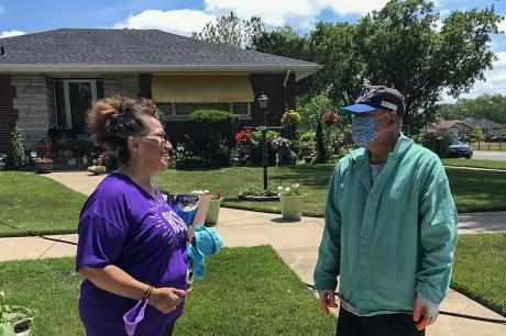Foundation volunteer speaking with community member