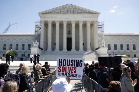 Homeless rights activists hold a rally outside of the U.S. Supreme Court on April 22, 2024 in Washington, DC