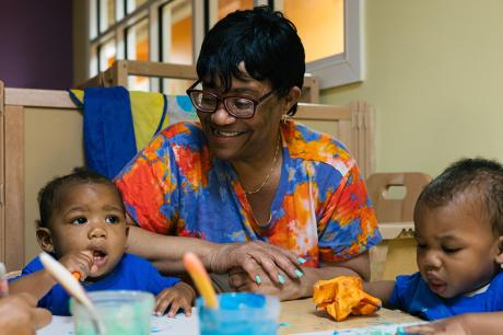 photo of caretaker and children