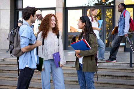 photo of young students standing together in college setting