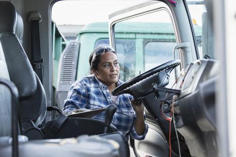 photo of worker getting into truck