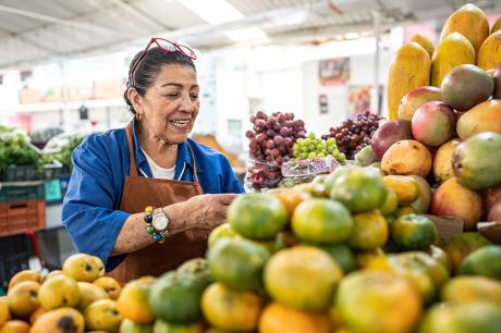 photo of woman at fruit market stand