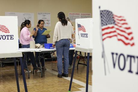 photo of poll workers taking their oaths at the Cameron County Courthouse polling place on March 5, 2024 in Brownsville, United States. 