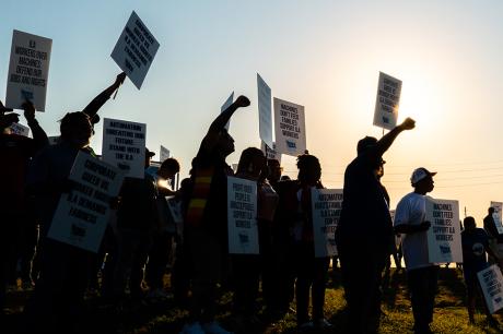 Dockworkers strike in a picket line outside of the Port of Houston Authority on October 01, 2024 in Houston, Texas.