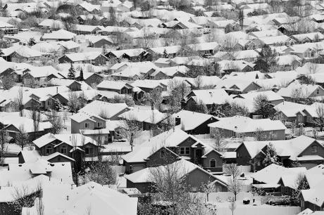 photo of snowy rooftops huddled together in this suburban winter scene