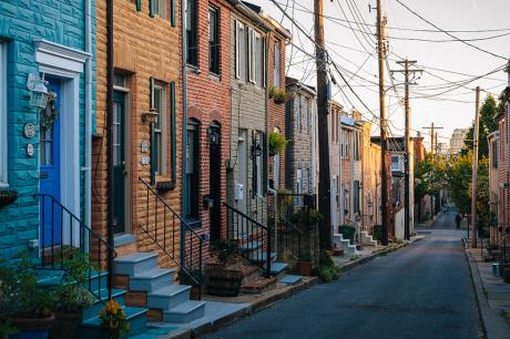 Colorful row houses along Chapel Street in Butchers Hill, Baltimore, Maryland