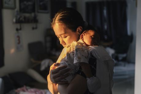 photo of parent holding child