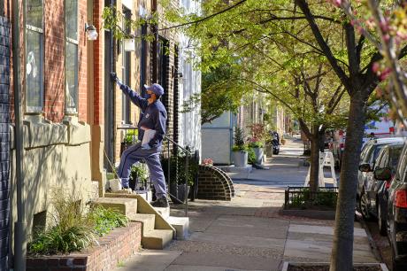 photo of US Postal Delivery on city street