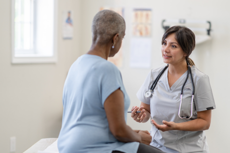 Older woman seeing a medical profesional 
