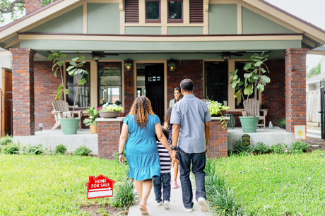 A family taking a tour of a for sale home.