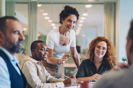 A group of professionals working together in a conference room. 