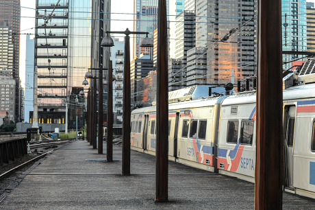 An aboveground train in Philadelphia idles outside the city.