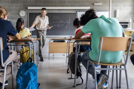 kids sitting in a classroom. 