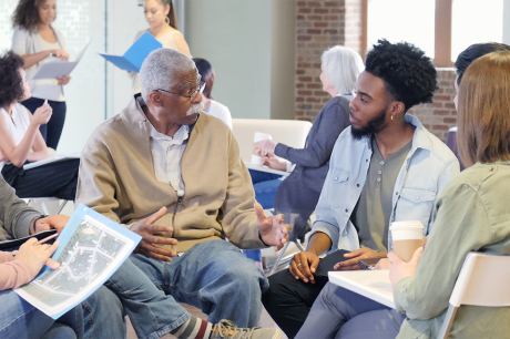 A group of adults sitting in a circle. 