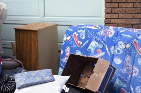 photo of Personal household belongings abandoned on urban sidewalk