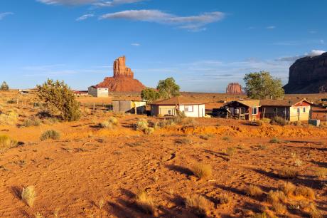 Desert homes beneath red rock buttes.