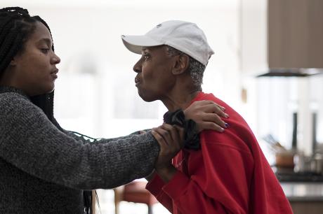 Women helps her mother who has Alzheimer's disease