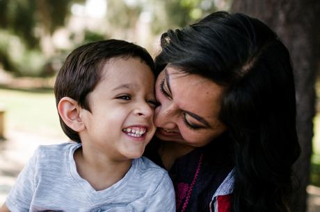 A mother holds her son