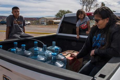 Family collects water for their home in the Navajo Nation