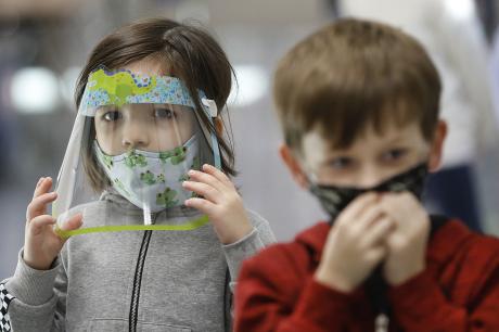 Kids wear masks and face shields 