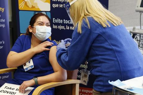 Nurse gets a COVID-19 vaccine