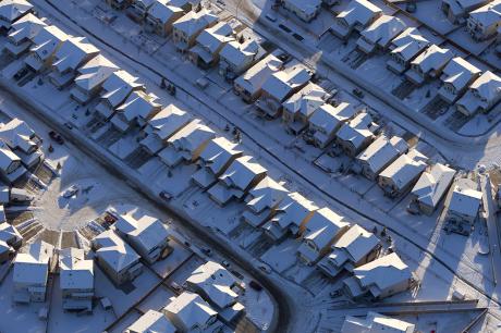 A neighborhood of snow-covered single-family homes