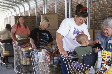People stand in line at the grocery store