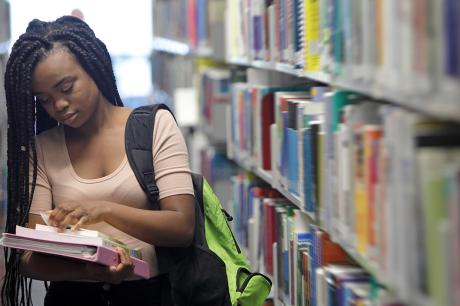 Student walks in library