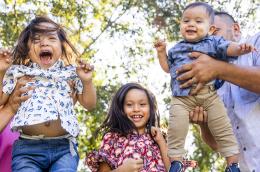 A family plays outside