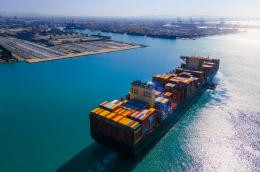 A shipping container boat on the water