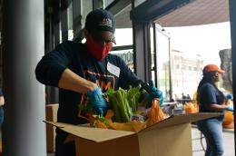 Worker prepares a food box