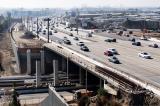 photo of freeway with multiple driving lanes