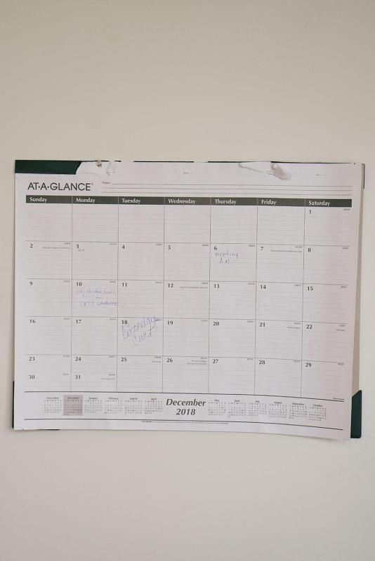 John keeps a calendar hung up in the middle of his living room to remember important days, like friends’ birthdays, doctor appointments, and when rent is due.